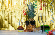 Cheerful Pineapple In Glasses Festive Happy Birthday Character With Number  18. Beautiful Background For Congratulations Copy Space On A Golden Background With Glasses Of Champagne. Anniversary 