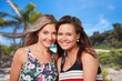 © BillionPhotos.com - Couple of happy young female friends on beach