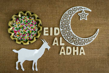 Wall Mural - Eid Al Adha concept image colourful candy with goat and crescent moon