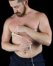 Man Measuring His Chest With Measuring Tape To See Muscle Gain Or Weight Loss Of Body Fat Percentage