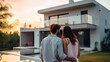 Happy young couple standing in front of new home - Husband and wife buying new house. Life style real estate concept.