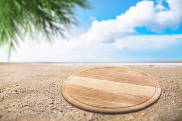 Sticker - Wooden blank pedestal at beach sand.