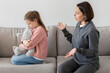 © Prostock-studio - Unhappy sad millennial caucasian woman scolding offended teen daughter with toy