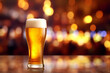 glass of beer on a table in a bar on blurred bokeh background