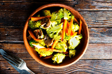 Wall Mural - Stir fry vegetables in bowl. broccoli, carrot and onion