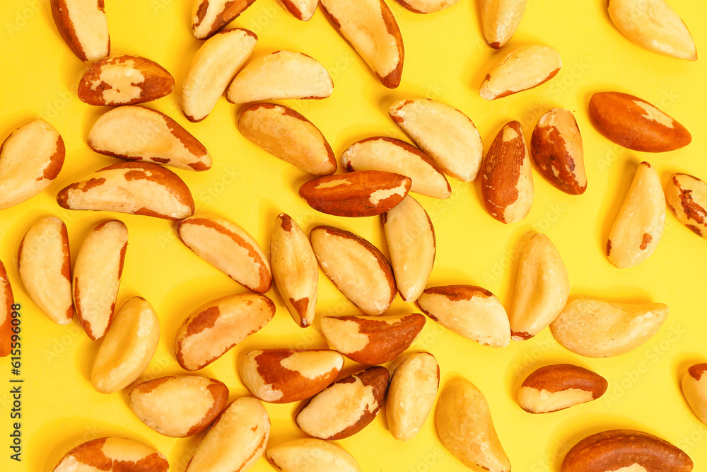 Delicious Brazil nuts on yellow background