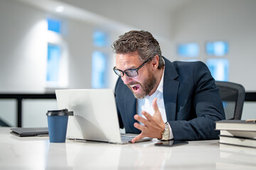 Wall Mural - Angry Business man entrepreneur startup owner in modern office. Angry Business portrait. Angry business worker. Business, finance and employment. Angry office worker.