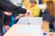 Leinwandbild Motiv voting candidate campaign in democracy ballot box. Latin mid hand unrecognizable man 