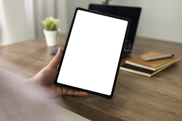 Wall Mural - man hand holding digital tablet touch white screen device isolated screen online advertising communi