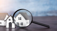 Magnifying Glass Showing A House. Home Buying Concept