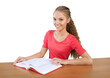 © BillionPhotos.com - Friendly Young Girl Sitting Behind a Desk with a Book - Isolated