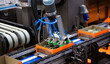 © Itsanan - Automated robot arm lifting food can to conveyor belt in food industry.