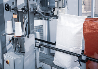 Food raw materials packing on sack bags binding machine.