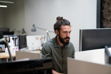 Concept of digital diagram,,programmer, software.Young finance analist working at modern office