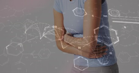 Wall Mural - animation of dna strand with data processing over midsection of biracial woman holding belly