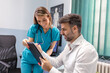 © Graphicroyalty - Young female professional doctor physician consulting patient, talking to adult man client at medical checkup visit. diseases treatment. medical health care concept