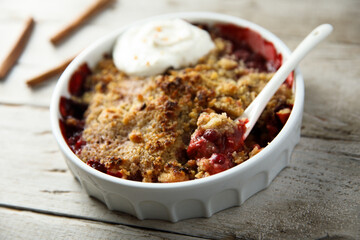 Canvas Print - Traditional homemade berry crumble with cream