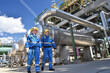 © industrieblick - group of workers professional equipment in a petroleum refinery - modern buildings and industrial facilities for the production of fuel and gas