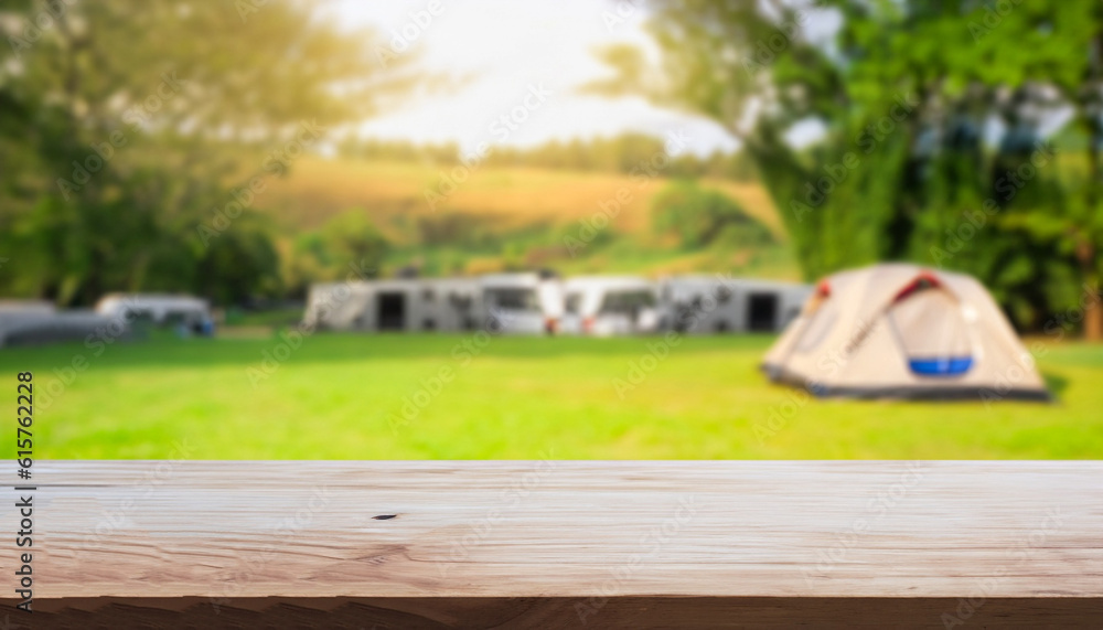 Wooden table top on blur tent camping travel tent and grass field. Fresh and Relax concept. For montage product display or design key visual layout. View of copy space.