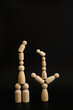 Person on stacked wooden blocks concept of balance or imbalance