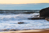 Fototapeta Morze - Sunrise and Waves - Surf's up at the seaside