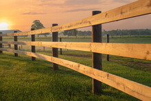 Sunrise Light An Arching Split Rail Fence On The Farm