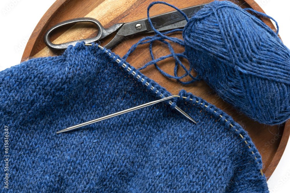 Blue Wool Yarn Knitting On The Metal Needles With Yarn Ball And Vintage blue-wool-yarn-knitting-on-the-metal-needles-with-yarn-ball-and-vintage