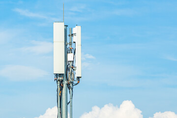 5G antenna on a telecommunication mast with a blue sky