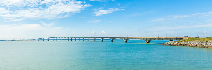 Wall Mural - Panoramic view of the Ile de Ré bridge seen from La Rochelle shore on a sunny day in Charente-Maritime, France