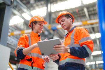 Wall Mural - Two Technicians or Engineers Checking and maintaining Machine Equipment of train in station.