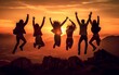 Groups of friends jumping on mountain with sunset in background, Generative Ai