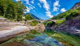 Roman bridge (Ponte dei Salti) crossing the Verzasca River at Lavertezzo in the Verzasca Valley, Canton of Ticino, Switzerland, Europe