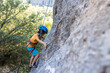 © zhukovvvlad - climber boy. the child trains in rock climbing.