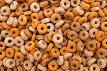 Multigrain Hoops Breakfast Cereal - Rings Of Wheat, Barley, Rice, Oats And Maize - As An Abstract Background Texture