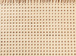 Embossed background of large-weave rattan stems close-up