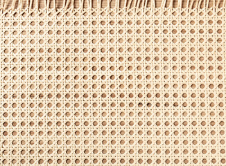 embossed background of large-weave rattan stems close-up