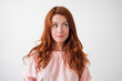 © Designpics - Portrait of young tender redhead woman with healthy freckled skin smiling and looking aside