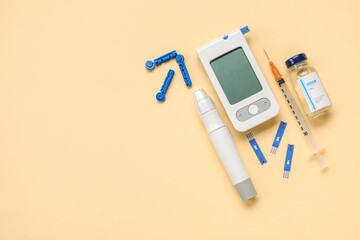 Wall Mural - Glucometer with lancet pen, insulin and syringe on beige background. Diabetes concept