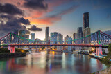 Fototapeta  - Cityscape image of Brisbane skyline, Australia with Story Bridge during dramatic sunset.