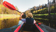 Close up kayaking woman without life-vest in river.POV of woman kayaking in beautiful green forest. Aquatic refreshing water sports in hot summer. Meditative calm relaxing activity