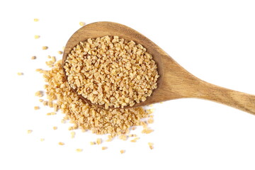 Wall Mural - Dry bulgur pile in wooden spoon isolated on white background, top view, clipping path