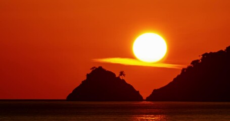 Wall Mural - Amazing big sun Beautiful light sunset sky nature Time Lapse, Golden sky and clouds in sunset time,Beautiful nature landscape background,Sun clouds  over sea Timelapse