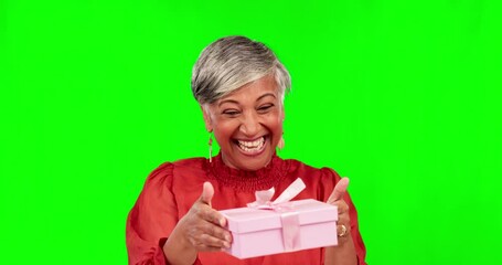 Poster - Gift, green screen and portrait of excited senior woman with a present on birthday isolated in studio background. Smile, happy and elderly female person with a surprise with happiness or celebration