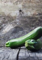 Canvas Print - Vegetables background. Fresh green zucchini  on wood in vintage setting