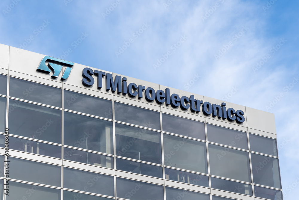 Close up of STMicroelectronics logo and sign on the office building in ...