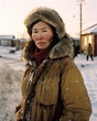 © DyrElena - AI generated portrait of middle aged woman traveling in Alaska