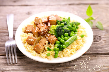Sticker - plate with fried tofu, bulgur and green vegetables- vegan lunch or dinner