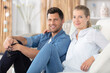 © auremar - middle age romantic couple sitting on the sofa at home