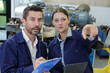 © auremar - engineer examining blueprint with construction manager