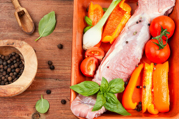 Sticker - Raw fresh meat tenderloin in a baking dish.